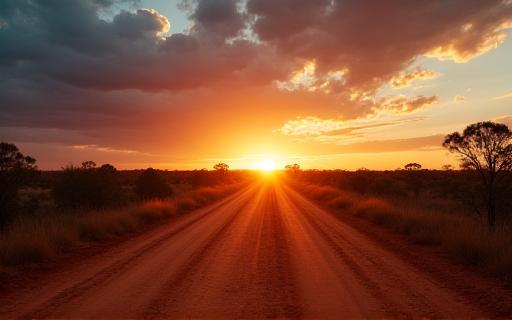 A dramatic, dusty outback road at sunset.